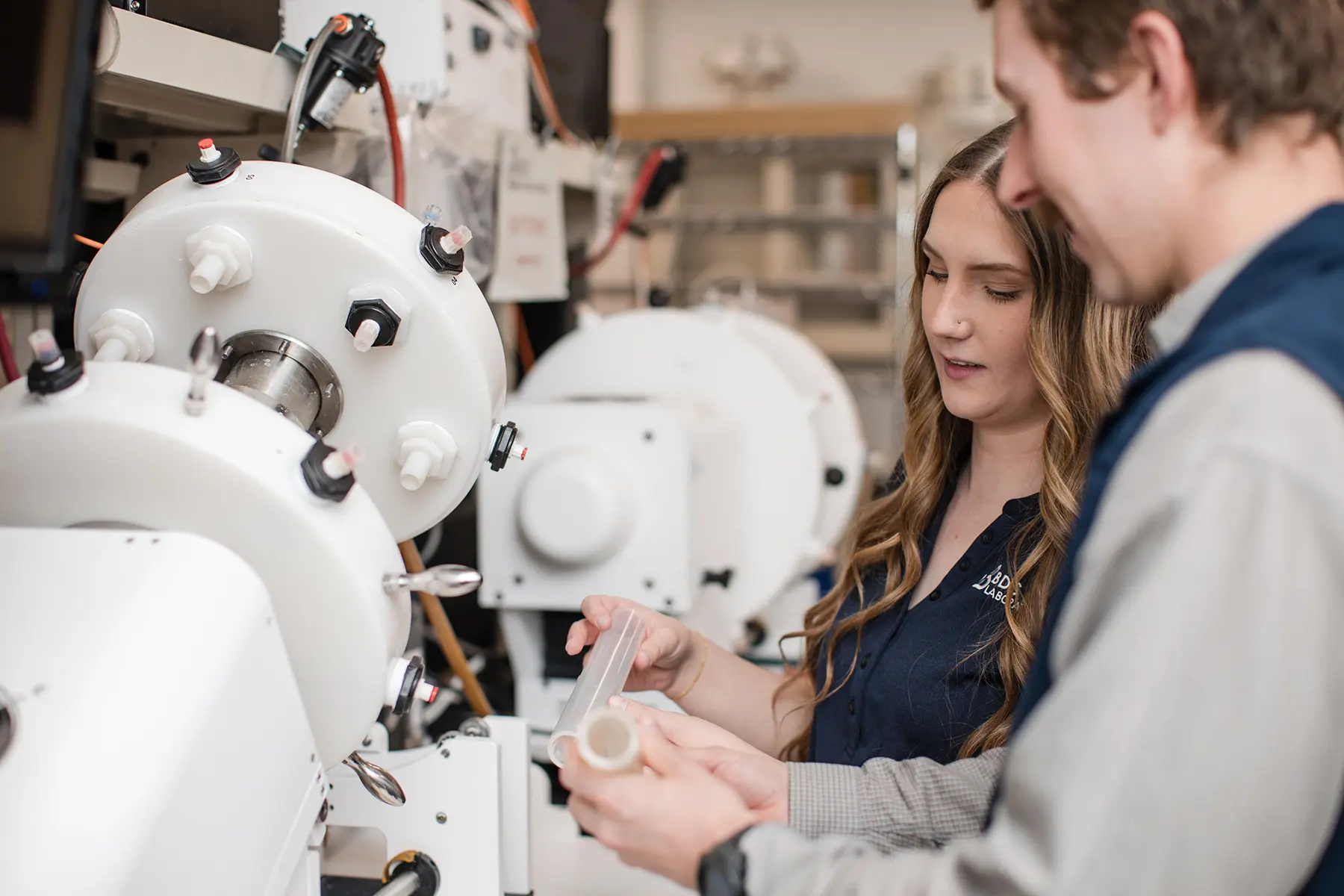 Team members in front of BDC Labs test equipment